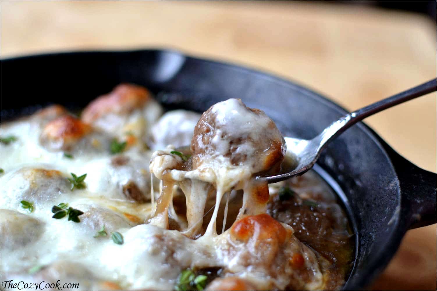 These meatballs are doused in rich caramelized onion sauce and topped with hot, melted cheese. They'll be the best meatballs you've ever had French Onion Soup Meatballs