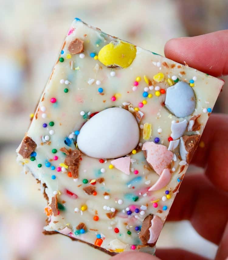 This Easy Easter Fudge has two luscious layers of chocolate mixed with sprinkles and topped with Cadbury mini eggs. This fudge is easy to customize and fun to make! Easter-Egg-Fudge