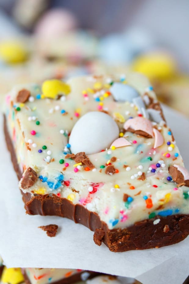 This Easy Easter Fudge has two luscious layers of chocolate mixed with sprinkles and topped with Cadbury mini eggs. This fudge is easy to customize and fun to make! Easter-Dessert