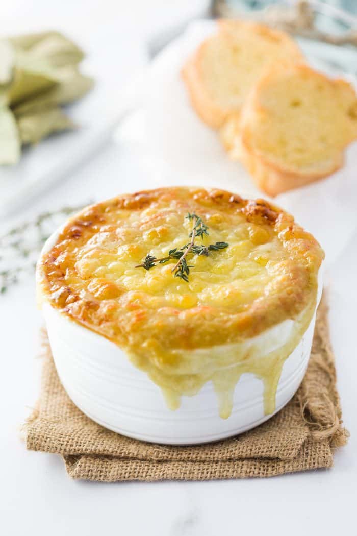 This instant pot french onion soup features perfectly caramelized onions in a rich, dark broth topped with a toasted baguette and hot and bubbly Gruyere cheese. Instant-Pot-French-Onion-Soup