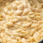 A pot full of creamy White Cheddar Shells and cheese for Panera Mac and Cheese recipe.