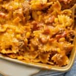 A close up view of pasta in a sloppy joe sauce in a casserole dish.